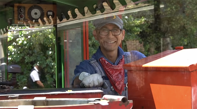 Cast Member Mark working on the Disneyland Railroad in his red All Aboard Going To Guides Fandana bandana
