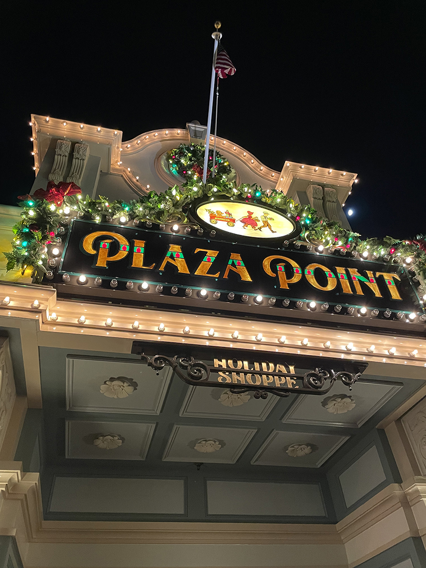 Plaza Point shop exterior lit up at night Main Street USA Disneyland