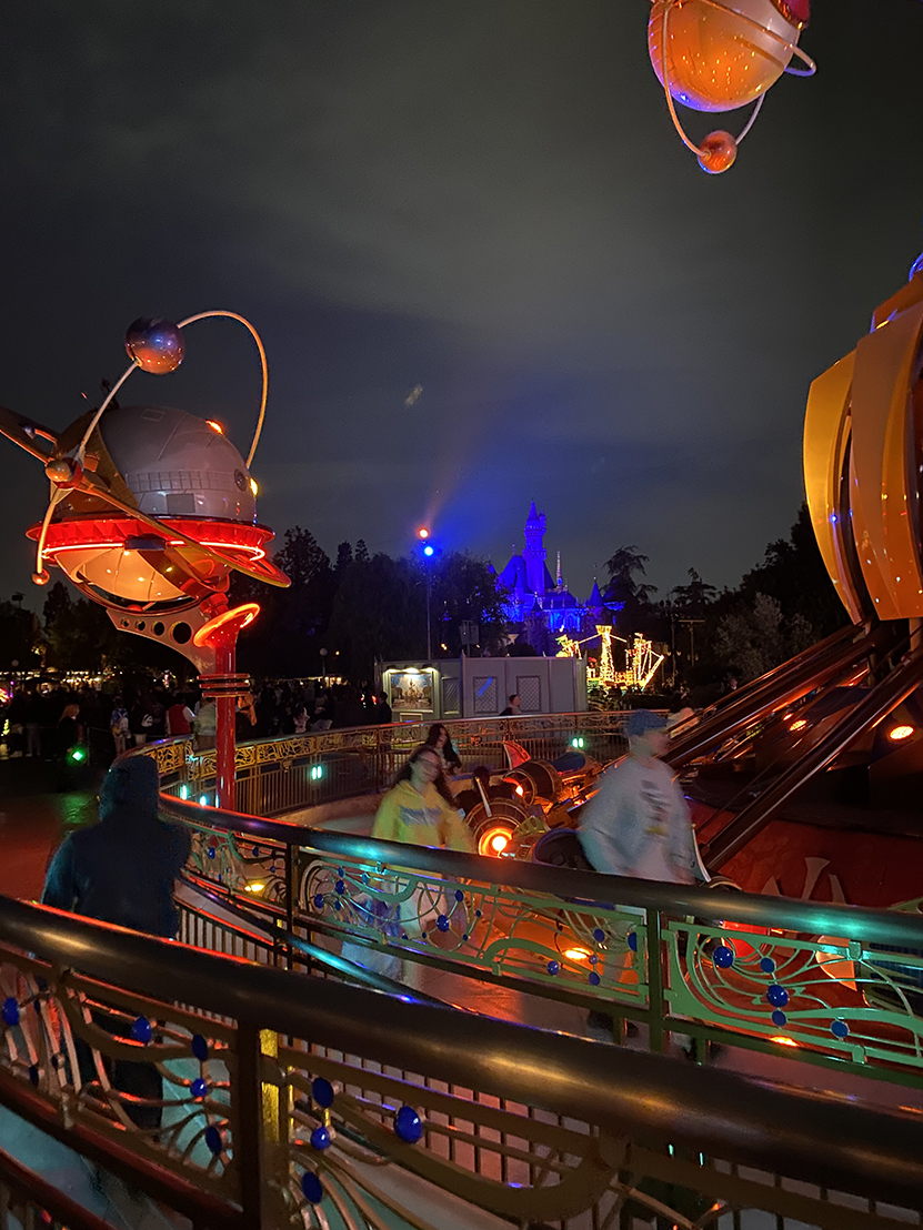 Astro Orbiter at night in Tomorrowland Disneyland