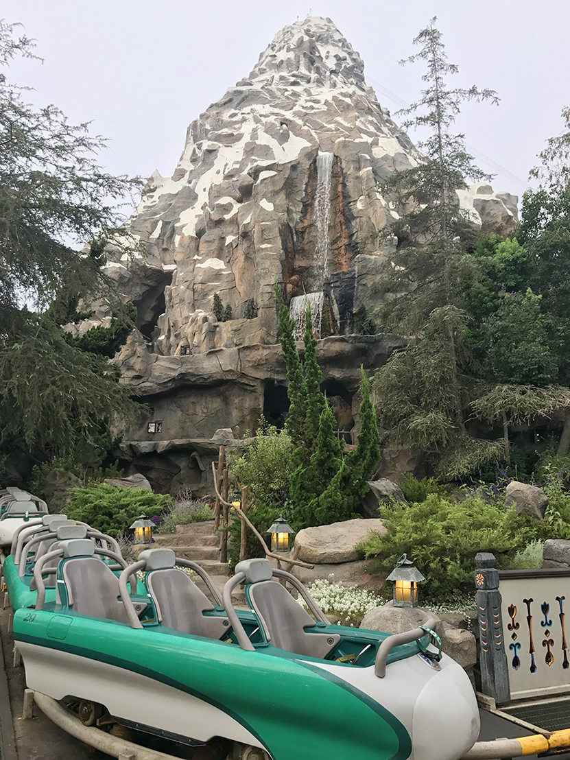 A bobsled in front of Matterhorn Bobsleds attraction in Disneyland's Fantasyland