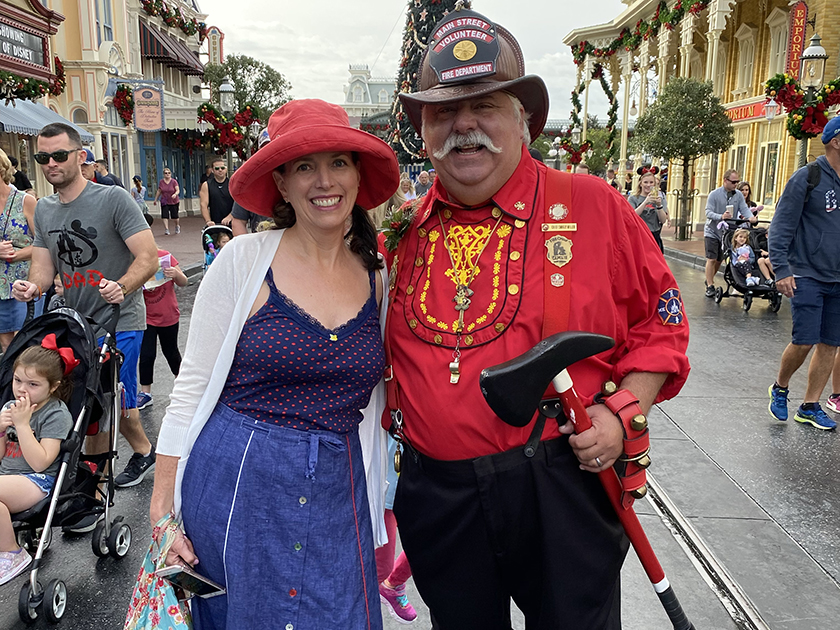 Shannon Laskey with fire chief on Main Street in Magic Kingdom